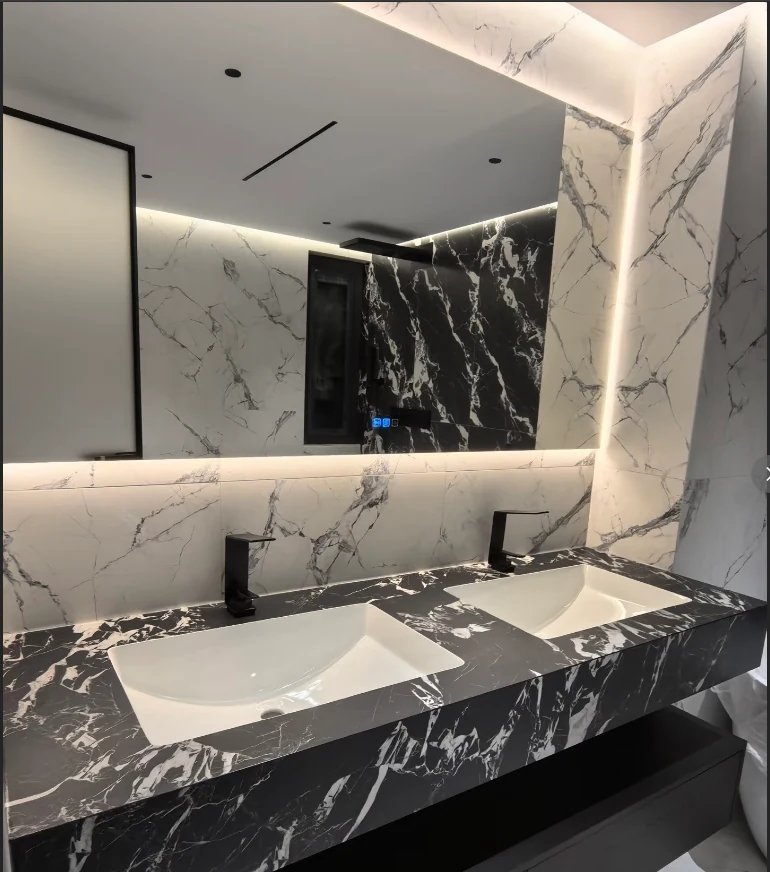 Black and white sintered stone bathroom vanity and wall cladding